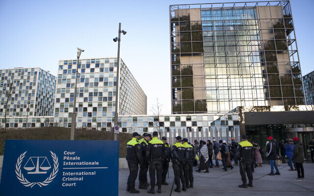 Illustrative: Police escort a group of supporters of former Ivory Coast president Laurent Gbagbo outside the International Criminal Court in The Hague, Netherlands, Thursday, Feb. 6, 2020. (AP/Peter Dejong)