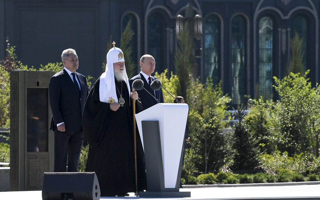 Russian Orthodox Church Patriarch Kirill, the Bishop of Moscow, center, delivers a speech as Russian President Vladimir Putin, right, and Russian Defense Minister Sergei Shoigu stand nearby at the dedication of the Main Cathedral of the Russian Armed Forces, June 22, 2020. (Alexei Nikolsky, Sputnik, Kremlin Pool Photo via AP)