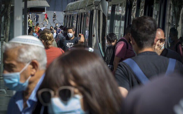 People wearing face masks walk  in Jerusalem  on June 16, 2020.(Olivier Fitoussi/Flash90)