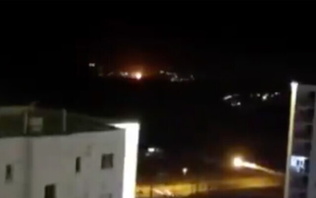 An explosion is seen in the night sky near Tehran in a video posted online by the country's Fars news agency, June 26, 2020. (Screenshot/Twitter)