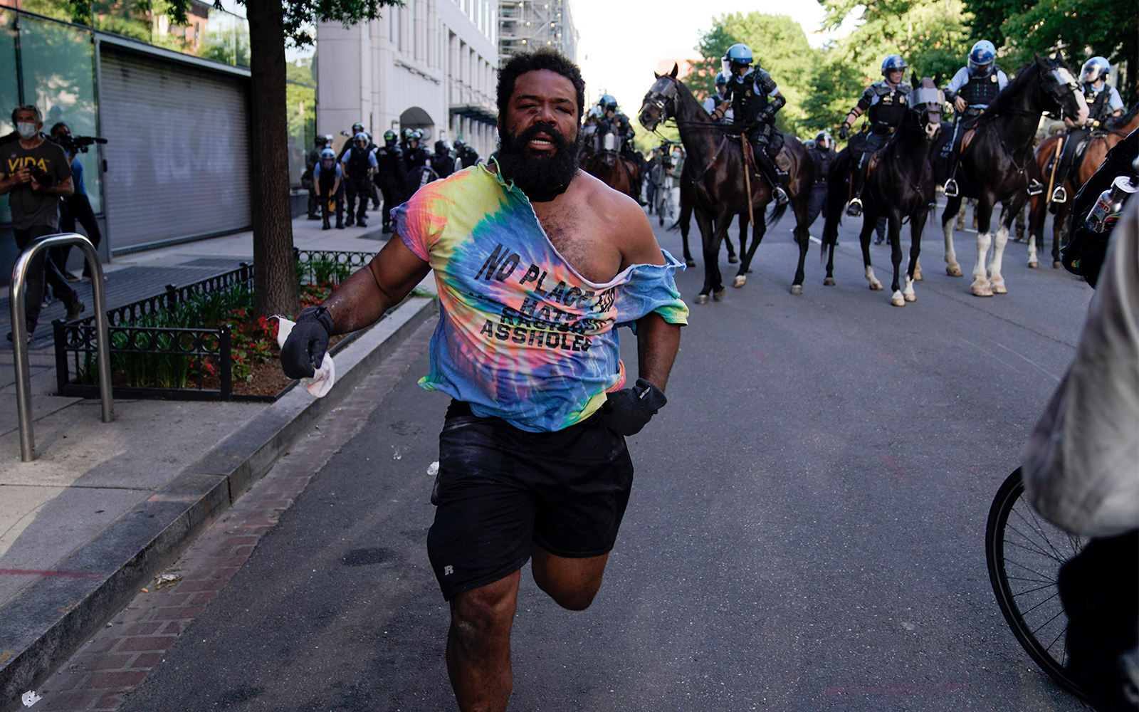 A demonstrator flees police near the White House in Washington, June 1, 2020. (AP/Evan Vucci)