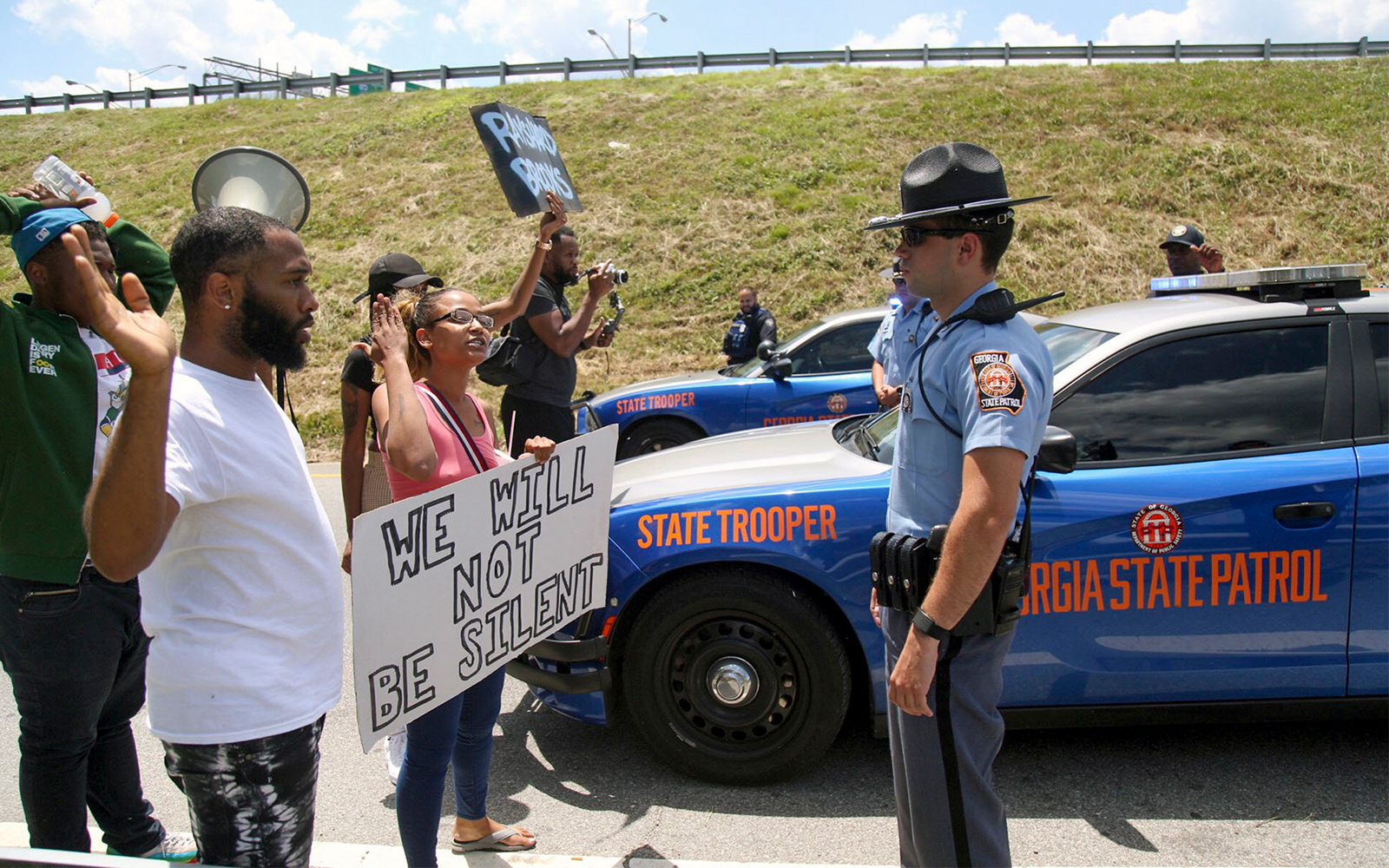 Protestors gather near a Wendy’s restaurant where police killed a black man, Atlanta, Georgia, June 13, 2020. (Steve Schaefer/Atlanta Journal-Constitution via AP)