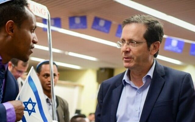 Chairman of the Jewish Agency Isaac Herzog welcomes members of the Ethiopian community on February 4, 2019. (Tomer Neuberg/Flash90)