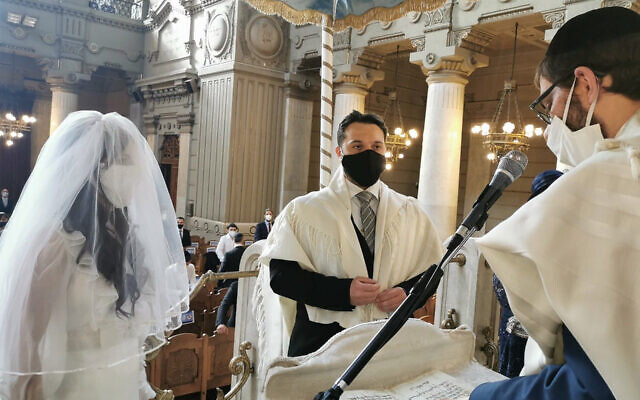 Illustrative: Rabbi Menachem Lazar, right, officiates at the wedding of Marco Del Monte and Elinor Hanoka at the Great Synagogue of Rome, June 7, 2020. (Courtesy of Chabad Piazza Bologna via JTA)