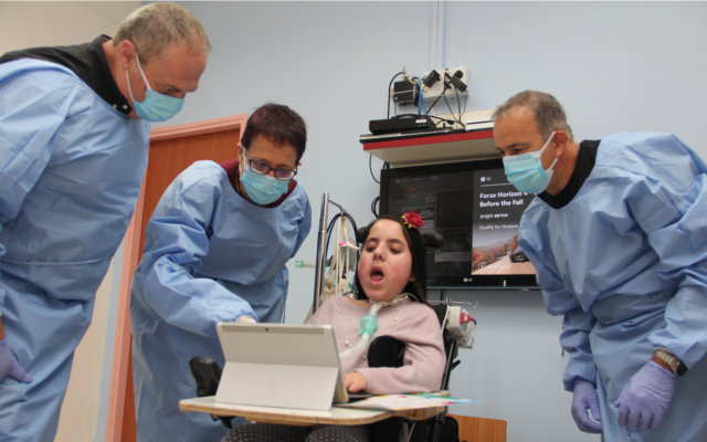 Microsoft's Yaron Galitzky, right to left, with 12-year old Lina, Dr. Maurit Beeri, Director General of ALYN Hospital, and Arie Yekel-Melamed, who manages the hospital’s innovation initiatives (Courtesy)