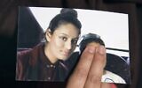 Renu, the eldest sister of Shamima Begum, holds a picture of her sister while being interviewed by the media in London, on February 22, 2015. (Laura Lean/Pool/AFP)