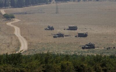 Armored vehicles and 155 mm self-propelled howitzers are deployed in the Upper Galilee in northern Israel on the border with Lebanon on July 27, 2020 (JALAA MAREY / AFP)