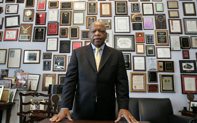 In this May 10, 2007 file photo, US Rep. John Lewis in his office on Capitol Hill, in Washington (AP Photo/Susan Walsh, File)