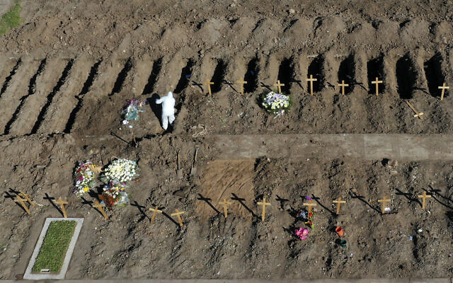Wooden crosses mark freshly dug graves at the Flores cemetery where people who died from the coronavirus are being buried, in Buenos Aires, Argentina, July 25, 2020. (Gustavo Garello/AP)