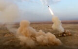 Illustrative: This frame grab from video shows the launching of underground ballistic missiles by the Iranian Revolutionary Guard during a military exercise on July 29, 2020. (Sepahnews via AP)