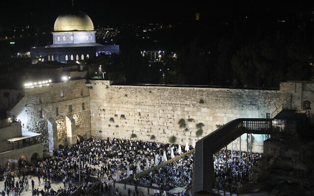 Thousands pray at the Western Wall on the eve of Tisha B'Av in the Old City of Jerusalem, on August 10, 2019. (Noam Revkin Fenton/Flash90)