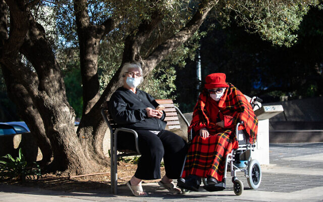 File: Elderly women wear face masks in Jerusalem, on April 26, 2020 (Olivier Fitoussi/Flash90)