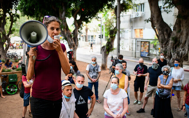 Israelis protest in Tel Aviv, calling for financial support from the government, on July 12, 2020. (Avshalom Sassoni/Flash90)