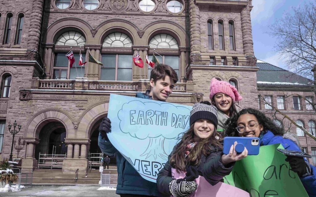 Hannah Alper, front row left, stands in front of the Ontario Legislative Building in Toronto during filming for the 'Citizen Kid' television program, February 2020. (Courtesy/ Peter Bregg)