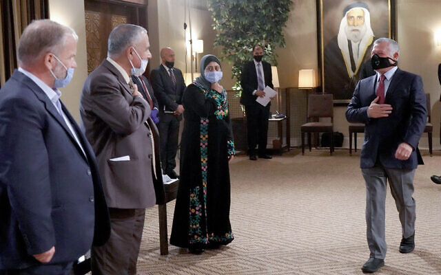 Jordanian King Abdullah II greets local notables during a meeting at the Al Husseiniya Palace near Amman on July 12, 2020. (kingabdullah.jo)