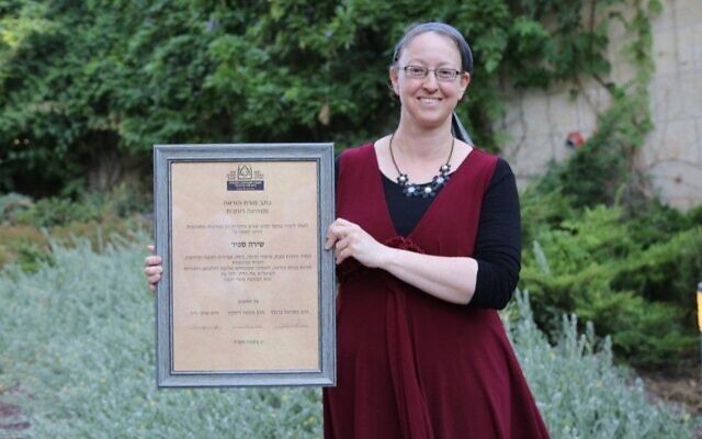 Shira Sapir receives her certification as "morat hora'ah" and spiritual leader from Ohr Torah Stone during a ceremony in Jerusalem, July 5, 2020. (Gershon Ellinson via JTA)