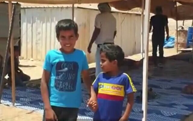 Ayman (L) and Muhammad al-Jahalin who were in a video made by children's entertainer 'Roy Boy,' July 13, 2020 (Screen grab/Channel 13 news)