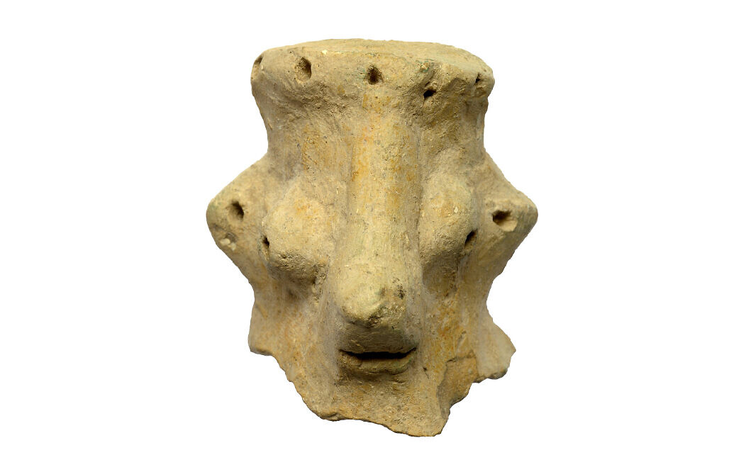 The face of Yahweh? A clay head dated to the 10th century BC, found at Khirbet Qeiyafa, some 20 miles from Jerusalem (Clara Amit, Israel Antiquities Authority)