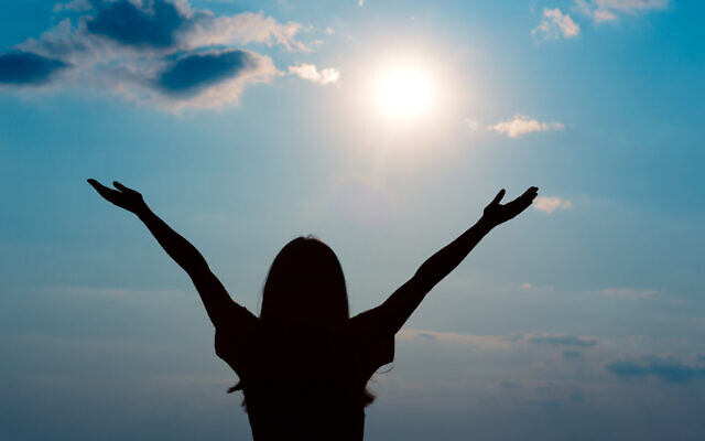 A woman enjoys sunshine, a source of vitamin D. (iStock)