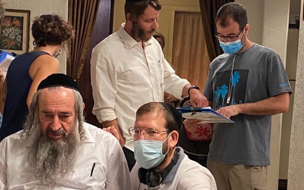 The cast of 'Shtisel' began filming its long awaited third season in July 2020, during the coronavirus, with director Alon Zingman in a mask, far right (Courtesy YES Studios)