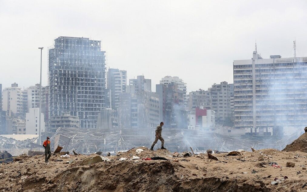 A soldier walks at the site of the massive explosion at the port of Beirut, August 6, 2020. (Thibault Camus/Pool/AFP)