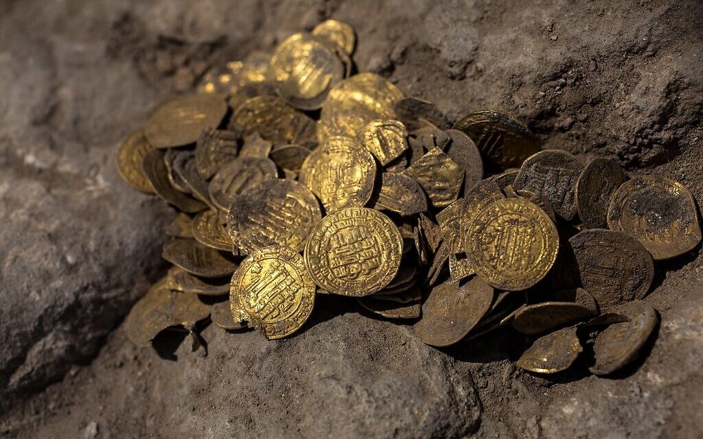 A hoard of gold coins dating to the Abbasid Caliphate is pictured during a press presentation of the discovery at an archeological site near Tel Aviv in central Israel (Heidi Levine / POOL / AFP)