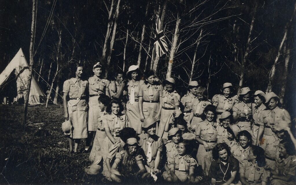A group of detained girls in a youth movement activity in a grove in Mauritius. (Courtesy Ghetto Fighters’ House Archives, Israel)