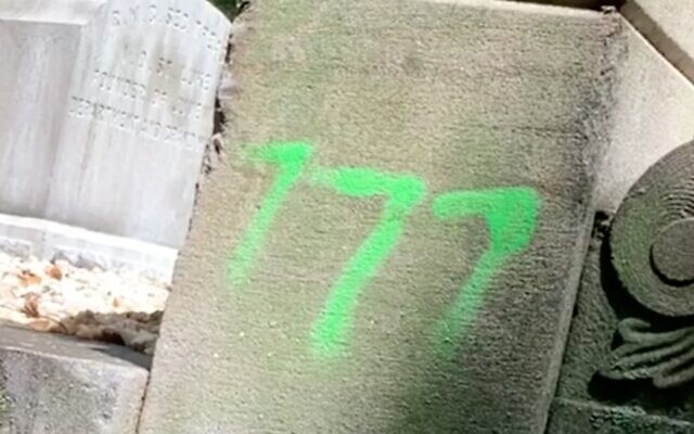 Screen capture from video of a hate symbol sprayed in two cemeteries in Richmond, Virginia, August 3, 2020. (Richmond Times-Dispatch via JTA)
