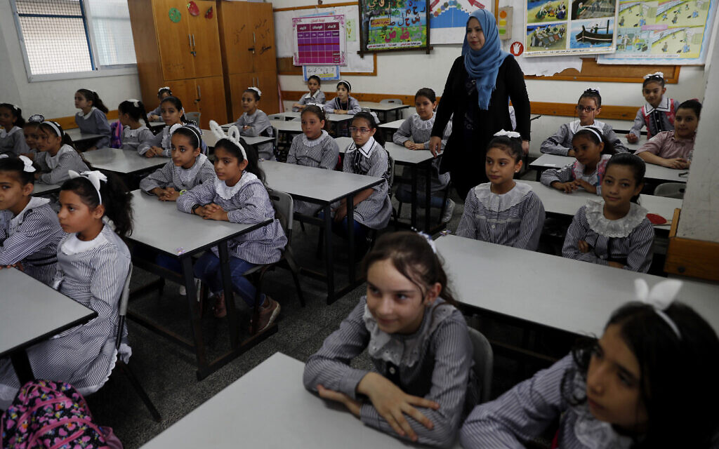 Students sit in a classroom on the first day of the new school year at the United Nations-run Elementary School at the Shati refugee camp in Gaza City, August 8, 2020. (AP Photo/Adel Hana)