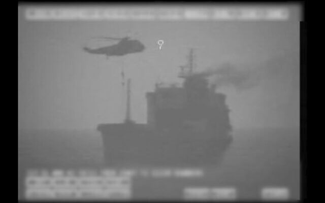 Iranian commandos fast-rope down from a helicopter onto the MV Wila oil tanker in the Gulf of Oman off the coast of the United Arab Emirates, August 12, 2020. (US military's Central Command via AP)