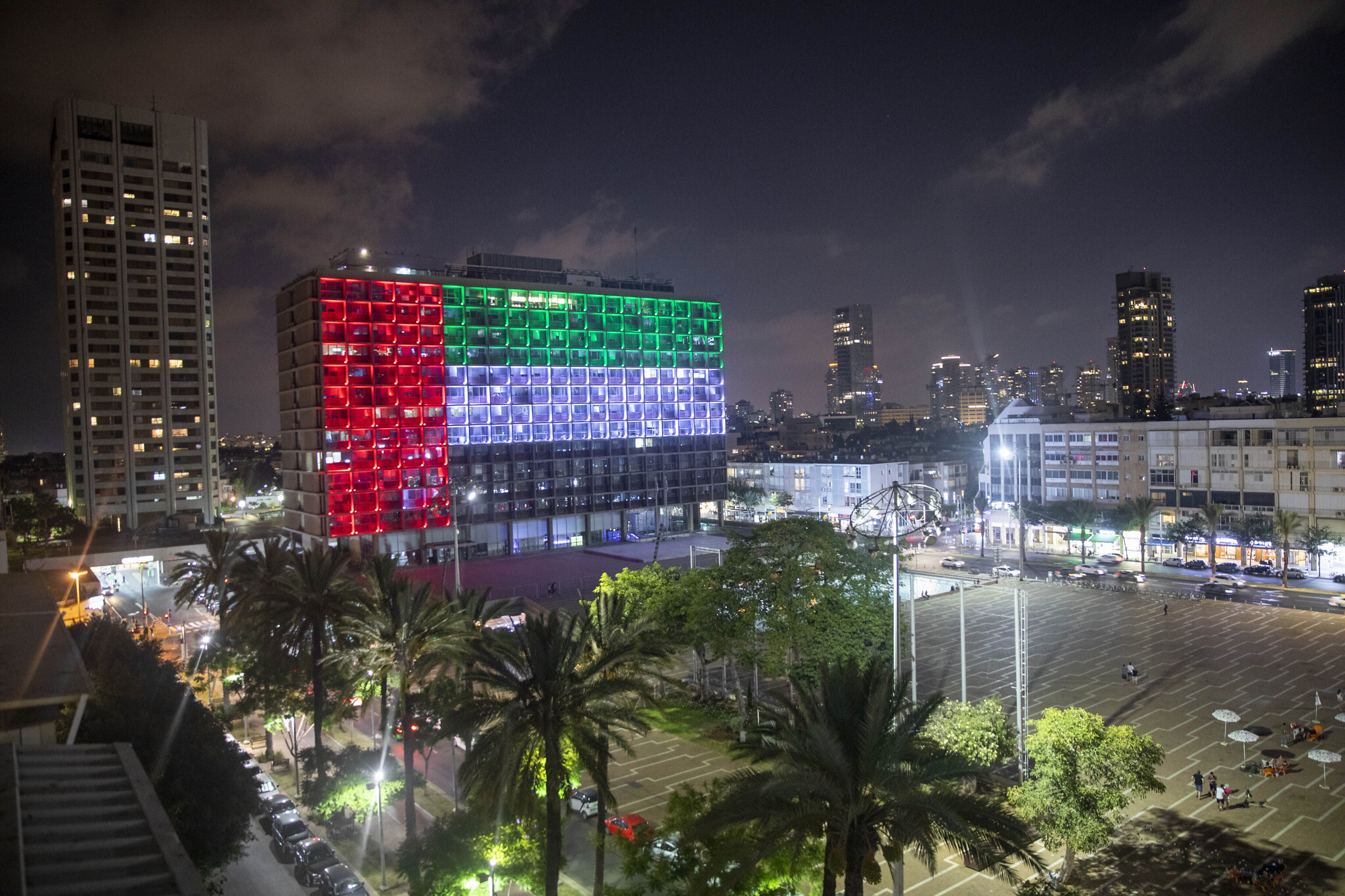 Tel Aviv City Hall is lit up with the flag of the United Arab Emirates as the UAE and Israel announce an agreement establishing full diplomatic ties, August 13, 2020, (AP Photo/Oded Balilty, File)