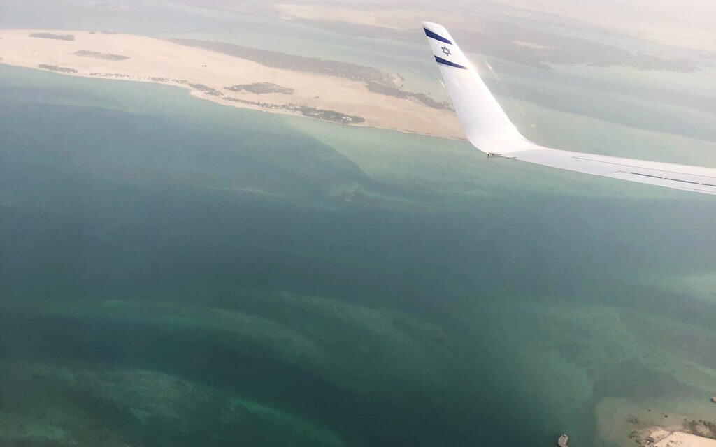 A wing tip with the Star of David is visible through the window of an Israeli El Al airliner just before the plane lands in Abu Dhabi, United Arab Emirates, Monday, Aug. 31, 2020.  (Nir Elias/Pool Photo via AP)