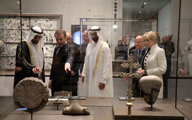 Abu Dhabi Crown Prince Mohammed bin Zayed al-Nahayan, 2nd right, Chairman of Abu Dhabi’s Tourism and Culture Authority, Mohamed Khalifa al-Mubarak, left, French President Emmanuel Macron, 2nd left, and his wife Brigitte Macron visit the Louvre Abu Dhabi Museum during its inauguration in Abu Dhabi, United Arab Emirates, Wednesday, Nov. 8, 2017. (Ludovic Marin/Pool photo via AP)