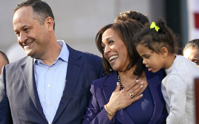 US. Sen. Kamala Harris, D-California, holds her niece Amara Ajagu, right, next to her husband, Douglas Emhoff, as she formally launches her presidential campaign at a rally in her hometown of Oakland, Calif., Sunday, Jan. 27, 2019. (AP Photo/Tony Avelar, File)