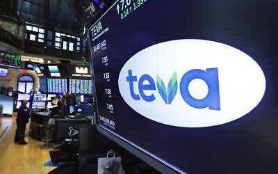 The logo for Teva appears above a trading post on the floor of the New York Stock Exchange, Monday, Oct. 21, 2019.  (AP Photo/Richard Drew)
