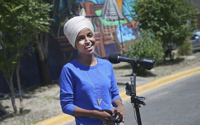 Democrat Rep. Ilhan Omar addresses media after lunch at the Mercado Central in Minneapolis, Minnesota, on August 11, 2020, primary election day in Minnesota. (AP Photo/Jim Mone)