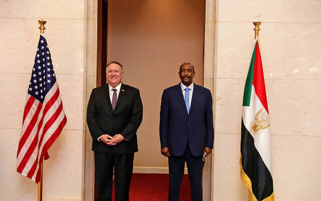 US Secretary of State Mike Pompeo stands with Sudanese Gen. Abdel-Fattah Burhan, the head of the ruling sovereign council, in Khartoum, Sudan, Tuesday, Aug. 25, 2020. (Sudanese Cabinet via AP)