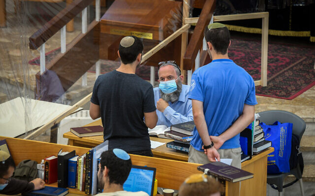 Illustrative: Jewish men study torah in small groups at the Orot Shaul Yeshiva in Tel Aviv on July 7, 2020. (Yossi Zeliger/Flash90)