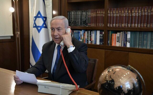 Prime Minister Benjamin Netanyahu at his office in Jerusalem on a phone call with UAE leader Mohammed Bin Zayed, on August 13, 2020. (Kobi Gideon/PMO)