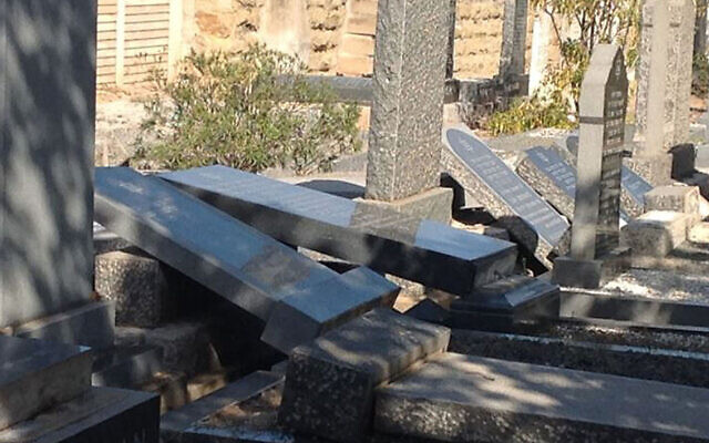 The aftermath of vandalism at the Oudtshoorn Jewish cemetery in South Africa. (Cape SAJB via JTA)