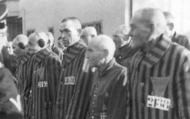 Inmates of the German concentration camp in Sachsenhausen, near Berlin, stand in line during an attendance check, December 19, 1938. German car parts maker Continental says it used slave labor from the camp during World War II. (AP Photo)