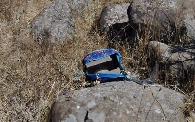 A bag with explosive devices inside it is seen near the scene where four Syrian suspects were killed Sunday night, after crossing the border and planting bombs, August 3, 2020. (Israel Defense Forces)
