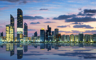 View of Abu Dhabi Skyline at sunset, United Arab Emirates (vwalakte; iStock by Getty Images)