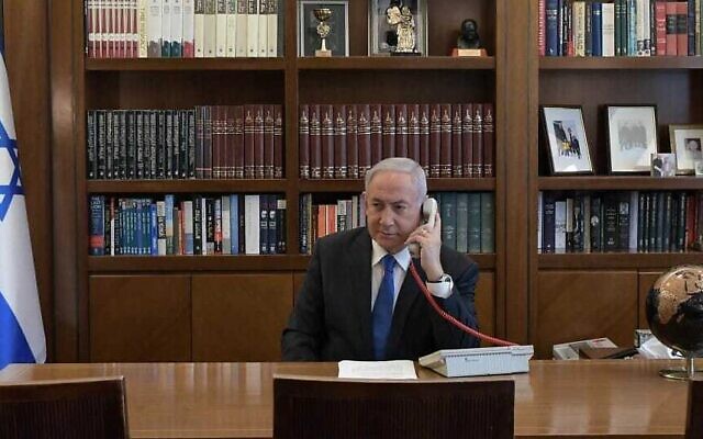 Prime Minister Benjamin Netanyahu at his office in Jerusalem on a phone call with UAE leader Mohammed Bin Zayed on August 13, 2020. (Kobi Gideon/PMO)