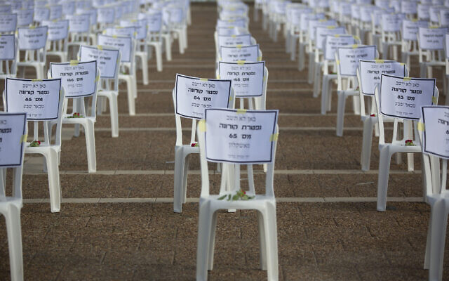 One thousand chairs are placed at Rabin Square in Tel Aviv to symbolize the deaths from the coronavirus pandemic, on Monday, September 7, 2020. (AP Photo/Sebastian Scheiner)