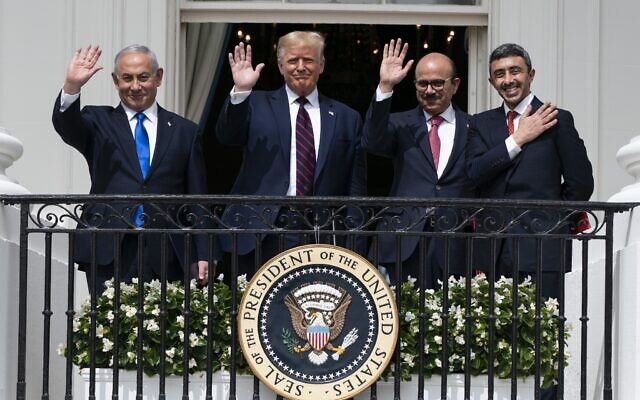 In this September 15, 2020 photo, Prime Minister Benjamin Netanyahu, left, US President Donald Trump, Bahrain Foreign Minister Abdullatif al-Zayani and United Arab Emirates Foreign Minister Abdullah bin Zayed al-Nahyan pose for a photo on the Blue Room Balcony after signing the Abraham Accords during a ceremony on the South Lawn of the White House in Washington. (AP Photo/Alex Brandon)