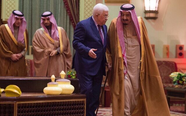 In this December 20, 2017, file photo released by Al-Ekhbariya, Saudi King Salman, right, receives Palestinian Authority President Mahmoud Abbas after he arrives in Riyadh, Saudi Arabia. (Al-Ekhbariya via AP, File)