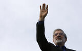 Mir Hossein Mousavi waves to his supporters as he arrives in a campaign gathering in downtown Tehran, Iran, June 8, 2009. (AP Photo/Vahid Salemi)