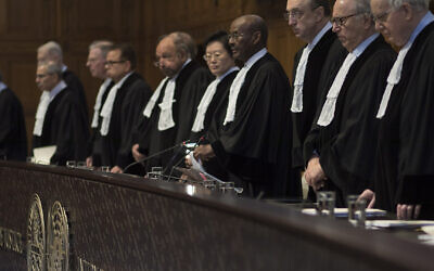 File: Judges take their seats prior to reading the court's verdict as delegations of Iran and the US listen at the International Court of Justice, or World Court, in The Hague, Netherlands, February 13, 2019.