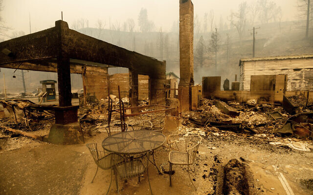 A table stands outside the destroyed Cressman's General Store after the Creek Fire burned through Fresno County, California on Sept. 8, 2020. (AP Photo/Noah Berger)